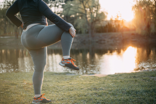 Lady Stretching Before Running After Successful Knee Pain Treatment in Fort Mill SC