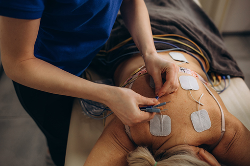 Spine Doctor Performing Hako-Med Therapy at a Clinic in Fort Mill South Carolina